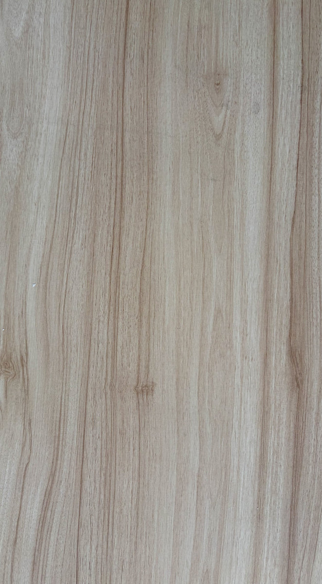 Close-up of a wooden surface with a light brown color and visible grain pattern.