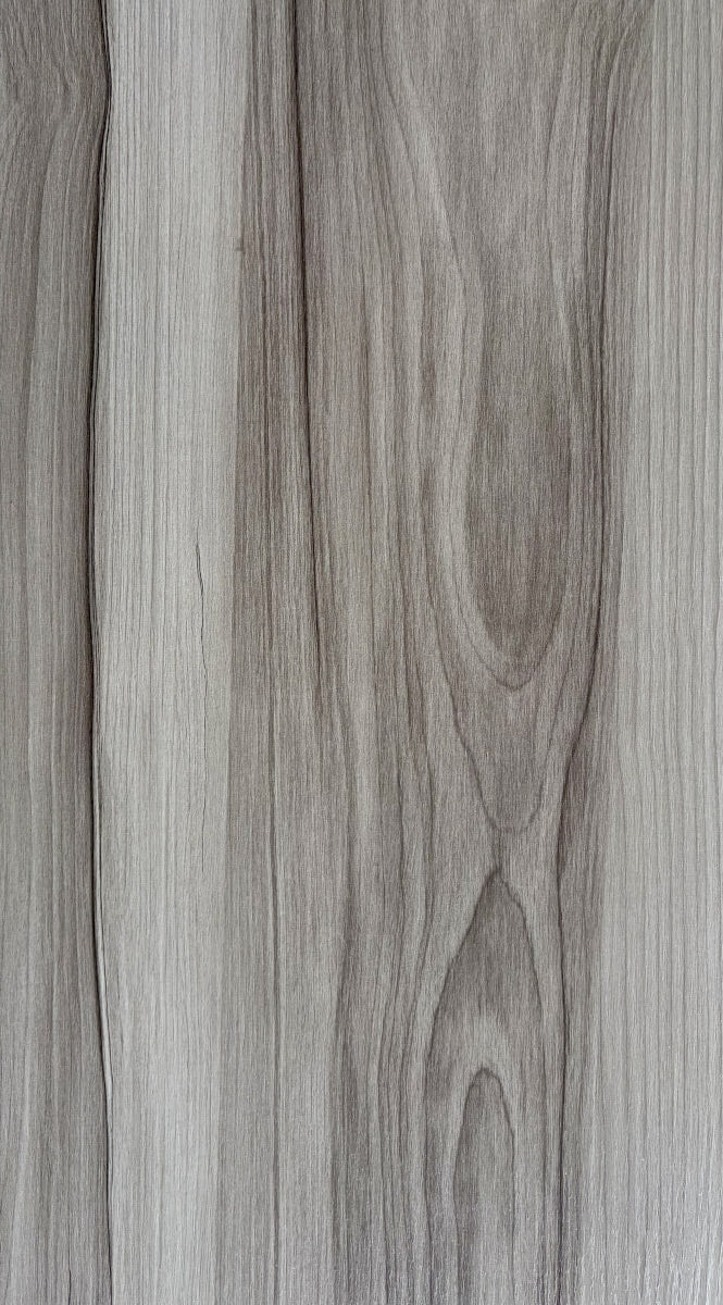 Close-up of a wooden surface with a grayish-brown color.