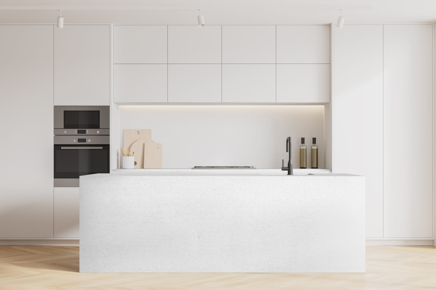 Modern kitchen with white cabinetry and island, featuring a sink and appliances.