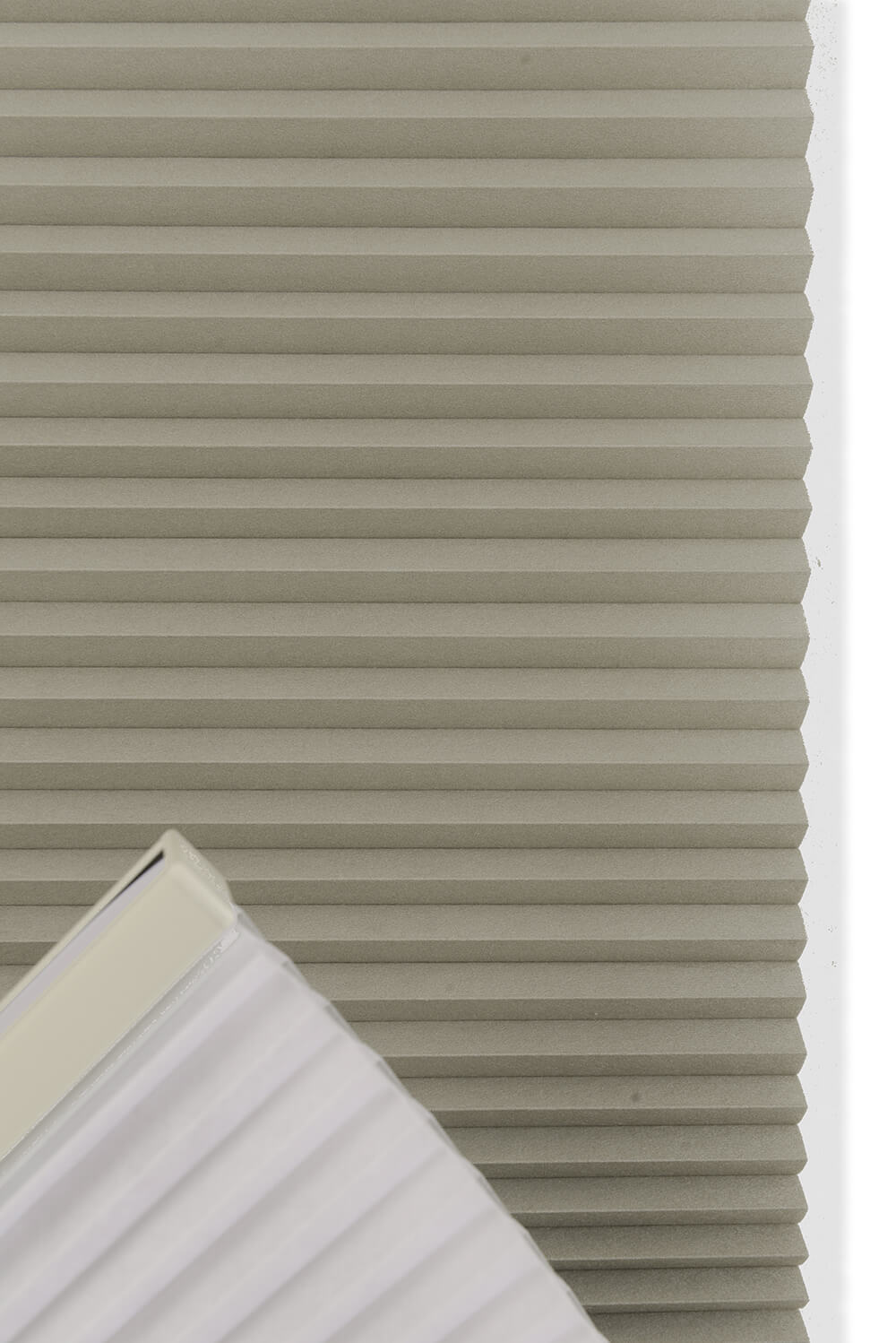 Close-up of pleated blinds with a white frame